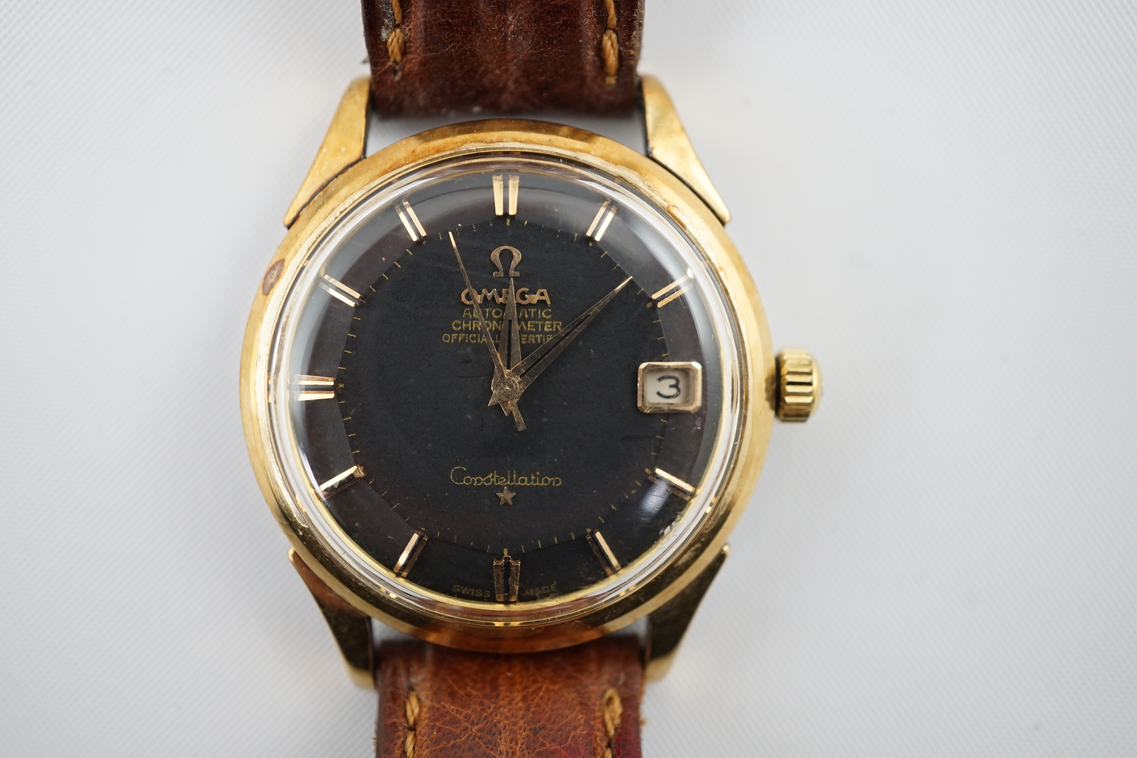 A gentleman's 1960's stainless steel and gold plated Omega Automatic Chronometer Constellation 'pie pan' black dial wrist watch